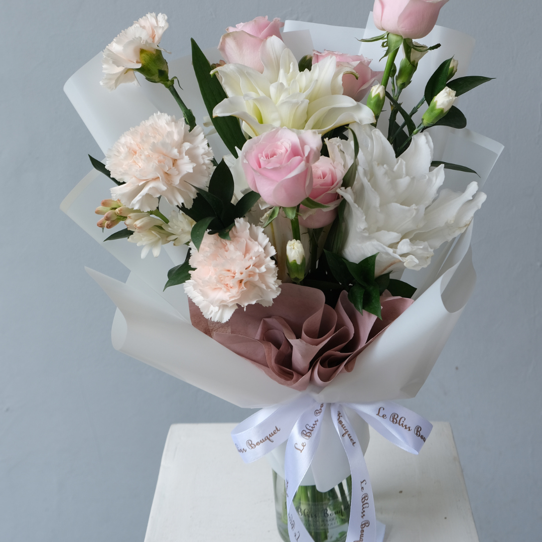 Hand-tied bouquet featuring Roselily, Holland carnations, and roses, no vase needed, perfect for celebrations, available with free greeting card. jakarta delivery florist indonesia