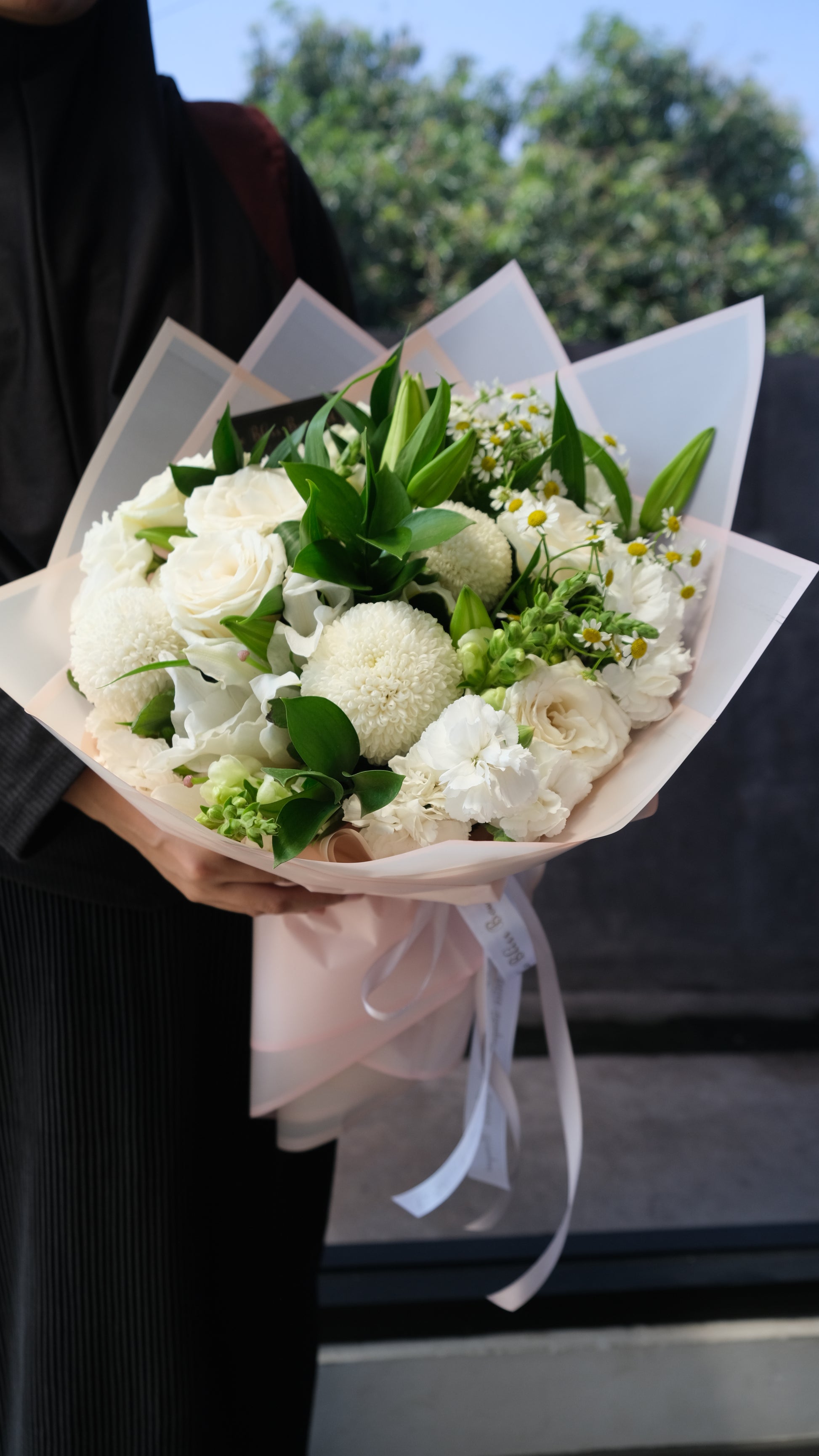 Classy White Round Bouquet with fresh white roses, lisianthus, and chrysanthemums, elegant hand-tied arrangement for flower delivery in Jakarta