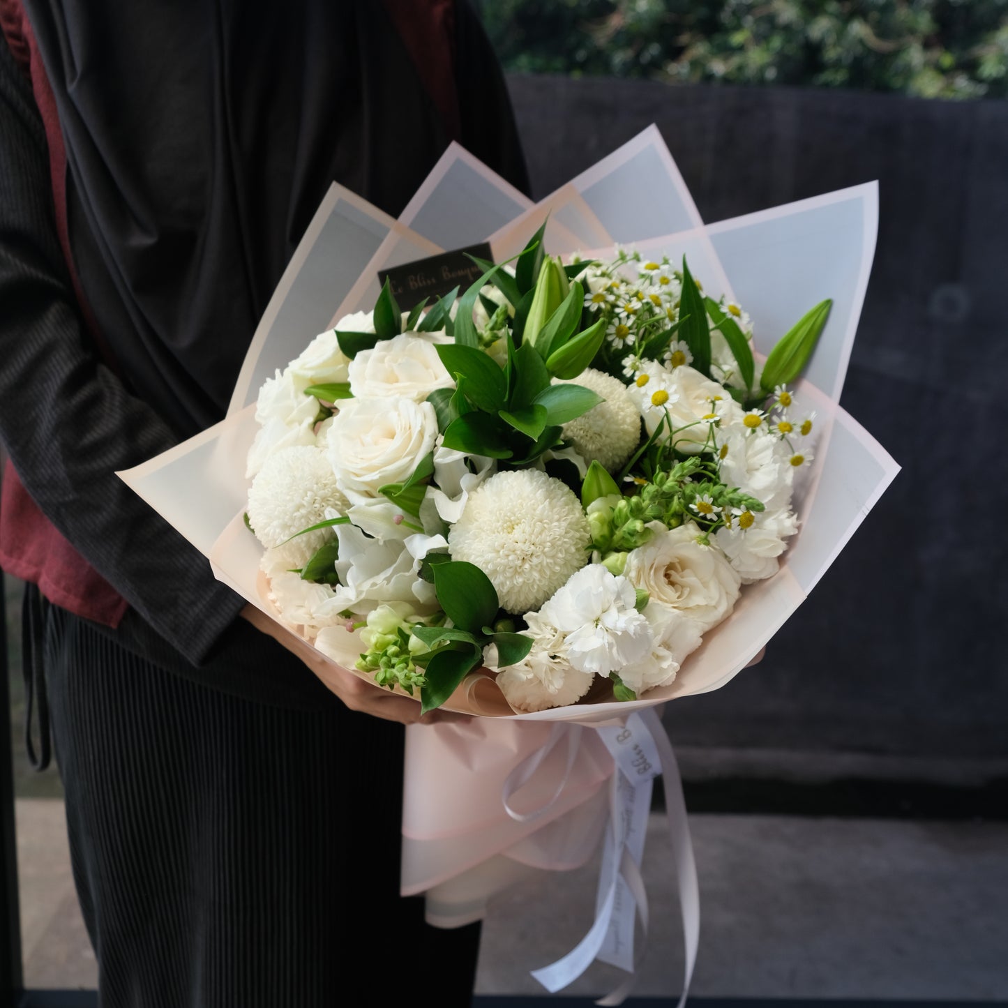 Classy White Round Bouquet with fresh white roses, lisianthus, and chrysanthemums, elegant hand-tied arrangement for flower delivery in Surabaya, Jakarta, Bintaro, Tangerang, and Cirebon
