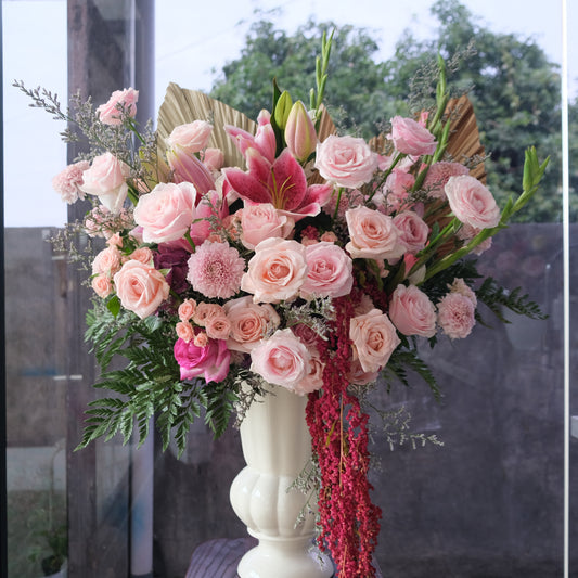 A vase arrangement featuring a variety of pink flowers, including roses and lilies, with greenery by Le Bliss Bouquet. Florist surabaya, florist jakarta, florist tangerang, florist cirebon