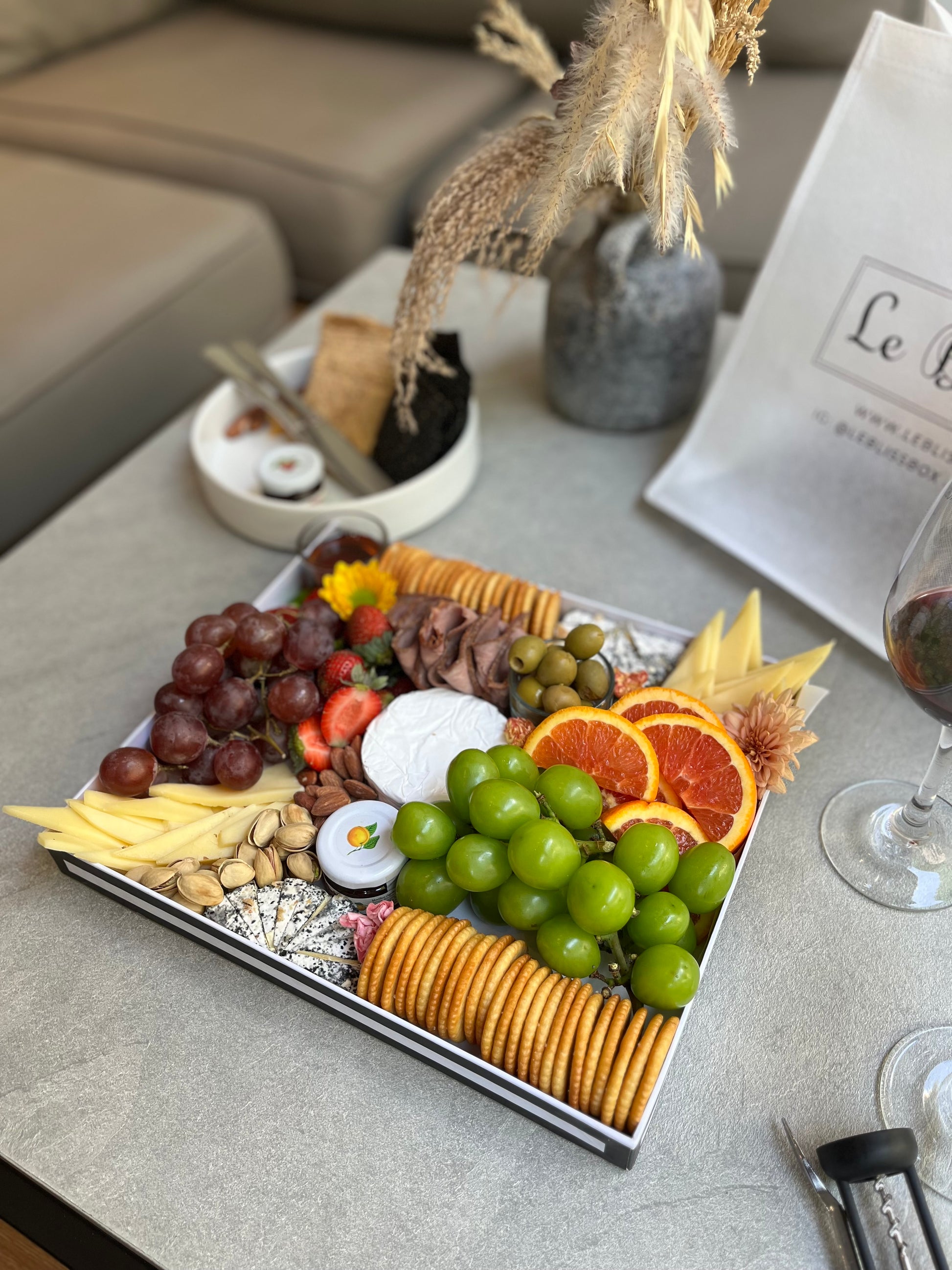 Fine charcuterie selection with cured meats, crackers, and fruit served in Jakarta