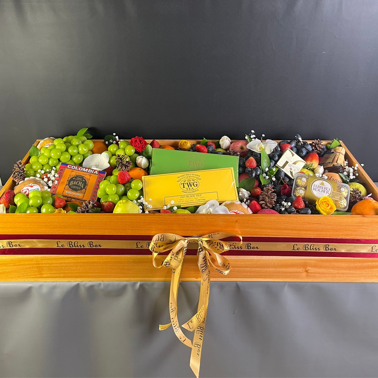 Parcel Buah besar dengan kombinasi twg tea, bacha coffee, Godiva chocolate, Ferrero, in a wooden box by Le bliss box. Grand fruit hamper