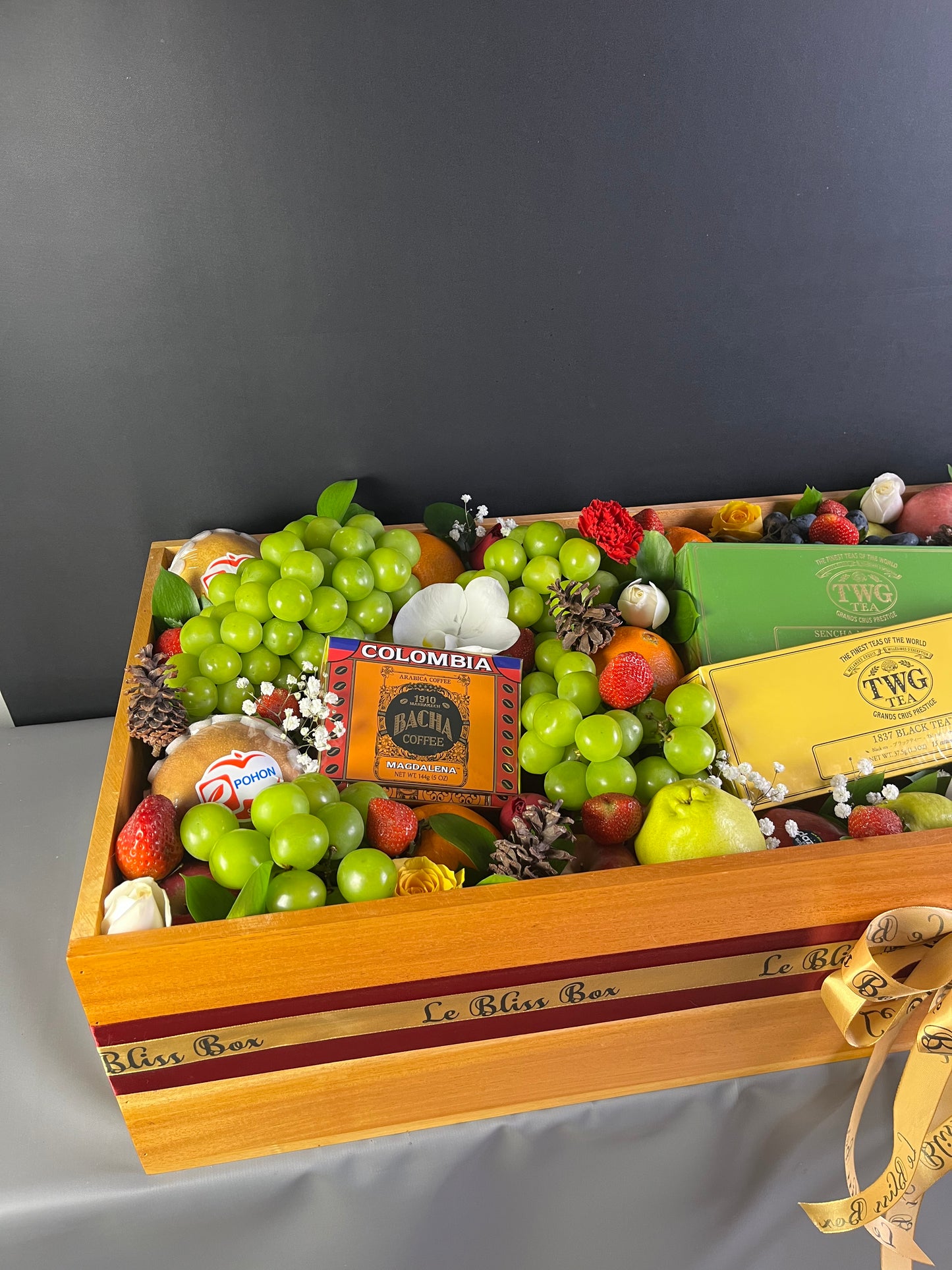 Parcel Buah besar dengan kombinasi twg tea, bacha coffee, Godiva chocolate, Ferrero, in a wooden box by Le bliss box. Grand fruit hamper