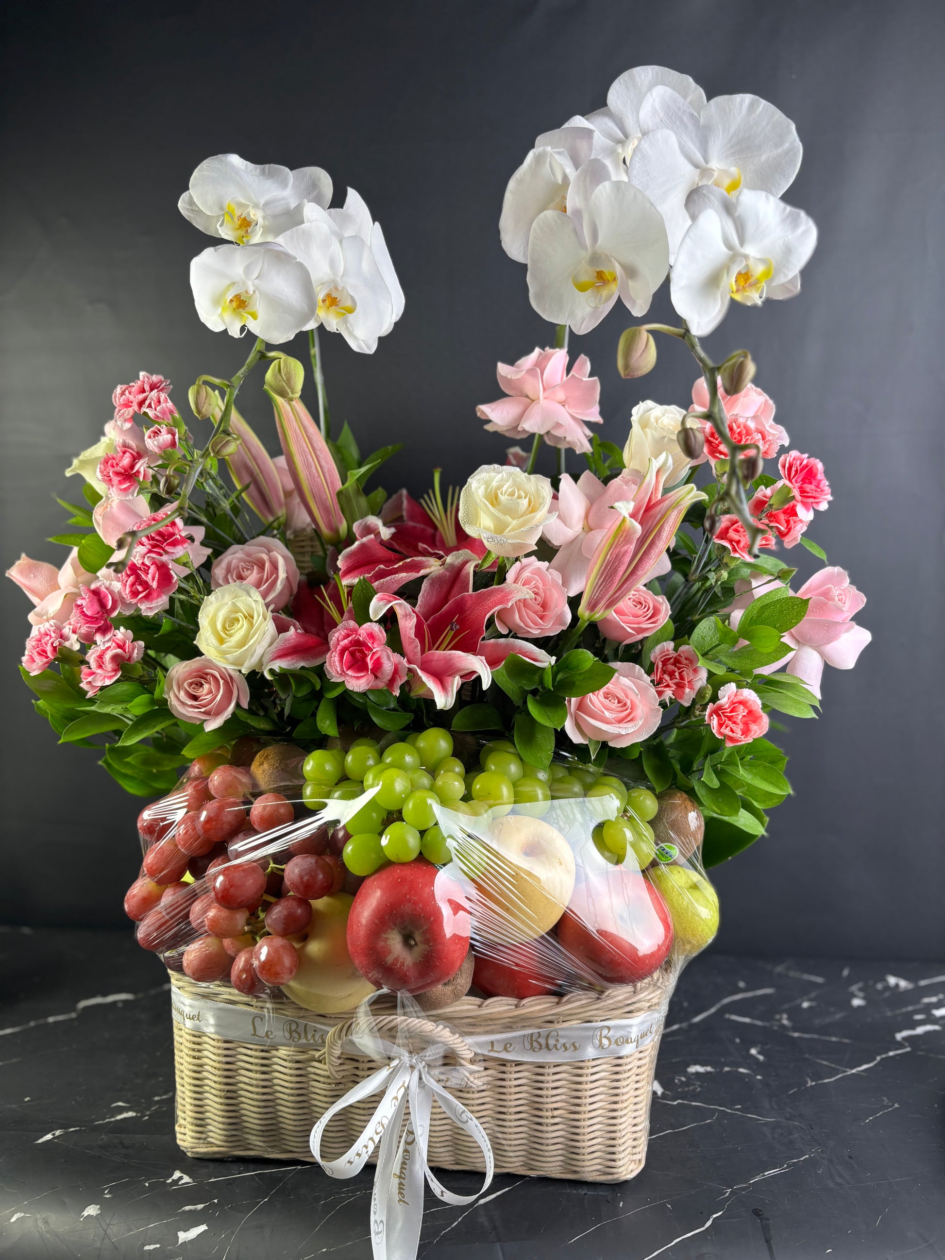 Parcel buah surabaya, premium luxury fruit hamper deliver to surabaya East Java with fresh orchids. by le bliss bouquet