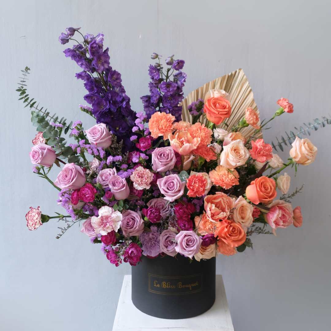 Rangkaian bunga Purple Delphinium dan Orange elegan dalam BloomBox untuk pengiriman ke Bintaro, Jakarta, Cirebon