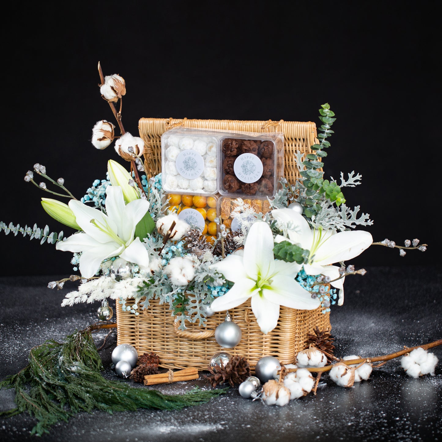 Winter Sonata Christmas Rattan Hamper with premium cookies and fresh flowers in a reusable rattan basket, ideal for holiday gifting. Available for delivery in Jakarta, Tangerang, and Cirebon.