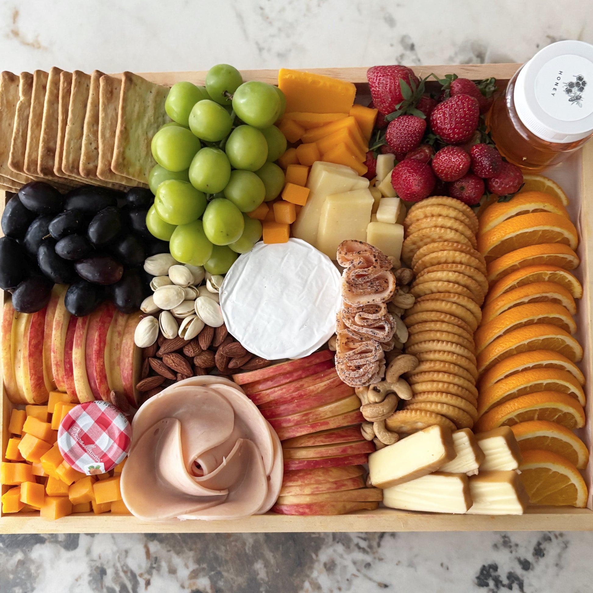 charcuterie board with chicken salami, chicken pastrami, cheese platter jakarta, cheese platter surabaya by le bliss platter