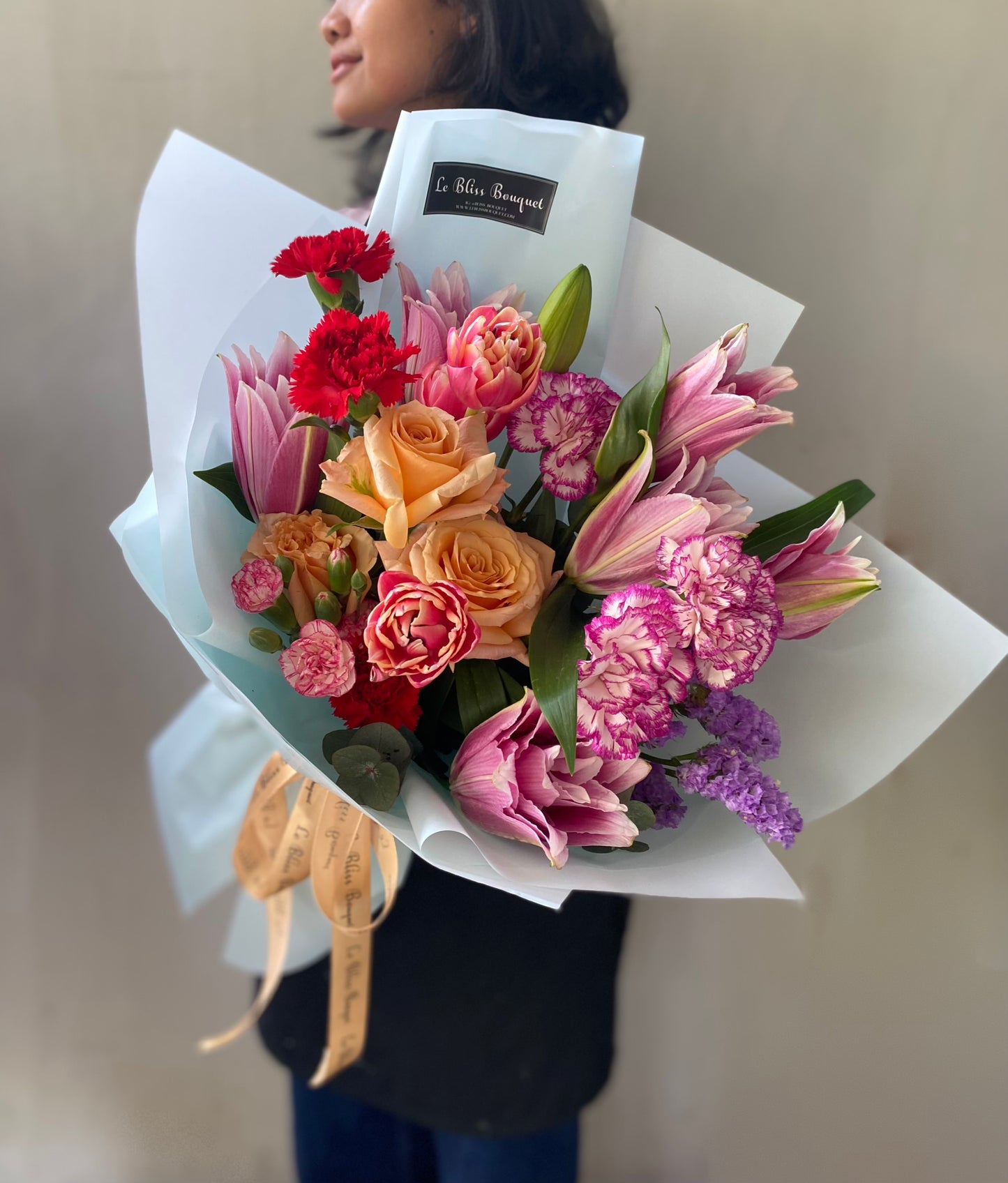 hand bouquet jakarta filled with tulips lily carnation and rose import