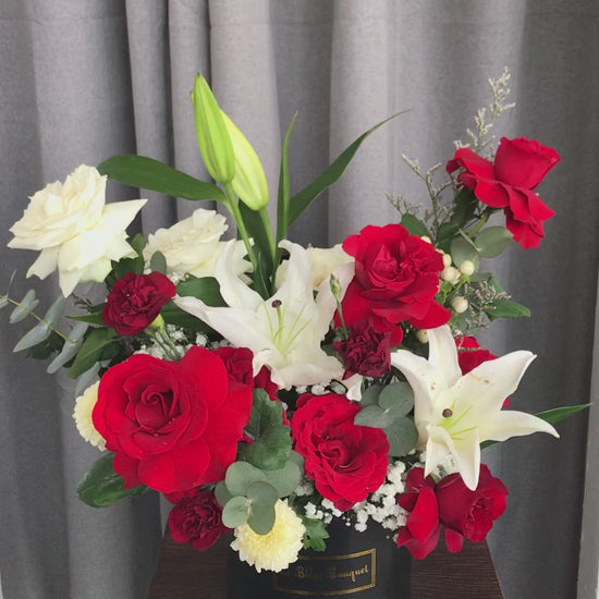 fresh flowers consist of red flowers roses and lily casablanca in a petite bloombox by le bliss bouquet. deliver to all surabaya area, florist surabaya, toko bunga surabaya