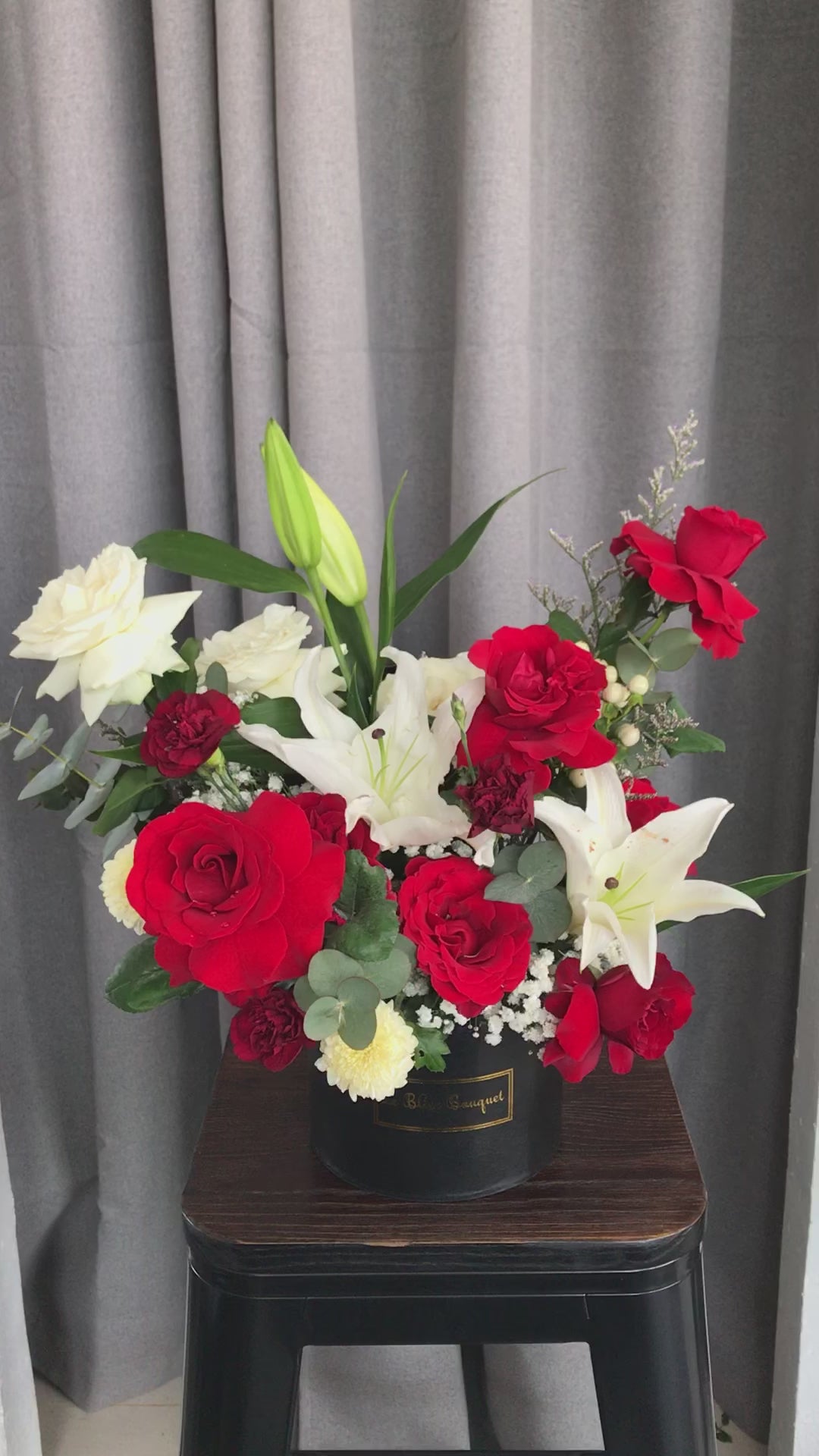 fresh flowers consist of red flowers roses and lily casablanca in a petite bloombox by le bliss bouquet. deliver to all surabaya area, florist surabaya, toko bunga surabaya