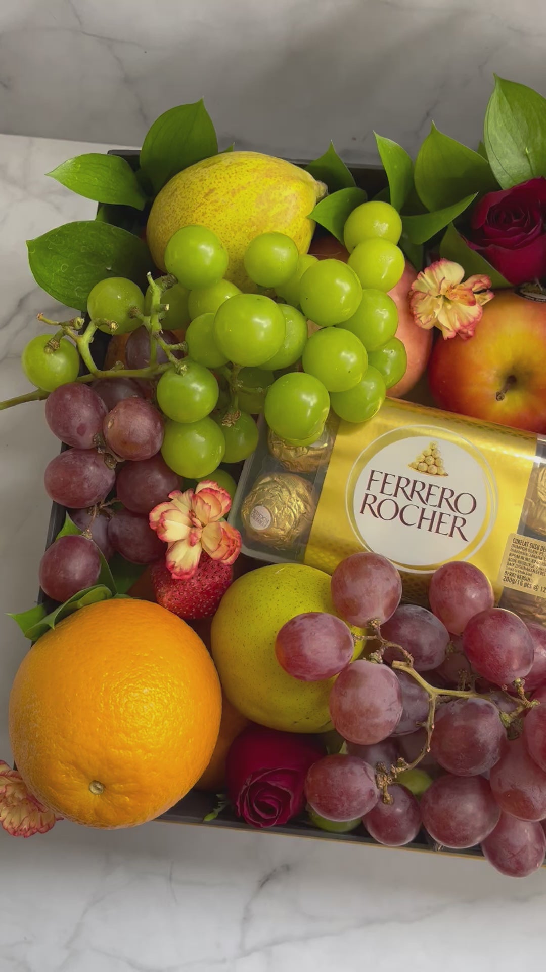 Luxury fruit hamper in Jakarta featuring a fruit box with imported seasonal fruits and Ferrero Rocher chocolates